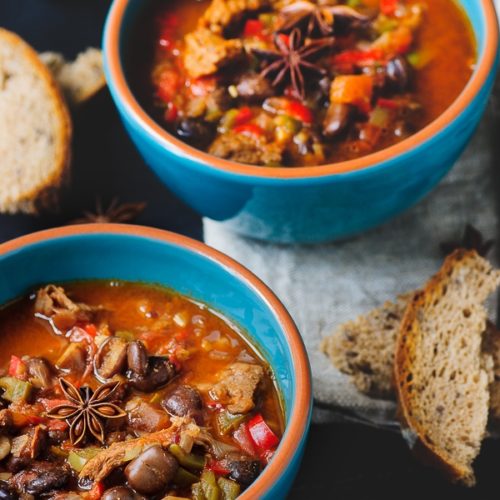 Two bowls of vegan soy curl chili with fava beans.