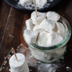 A bunch of vegan marshmallows in a jar.