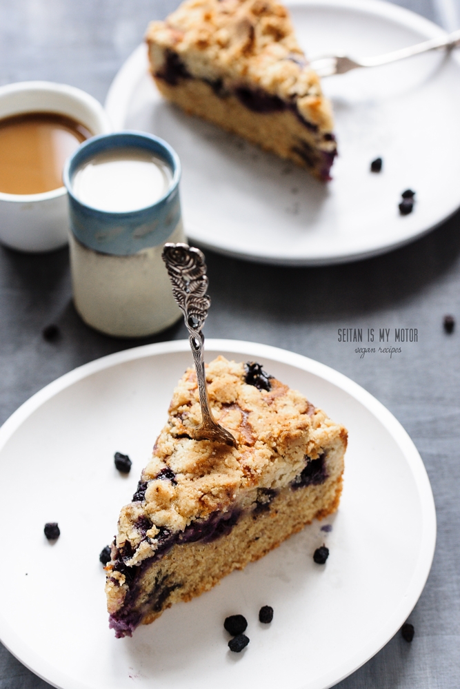 a slice of blueberry crumb cake on a plate