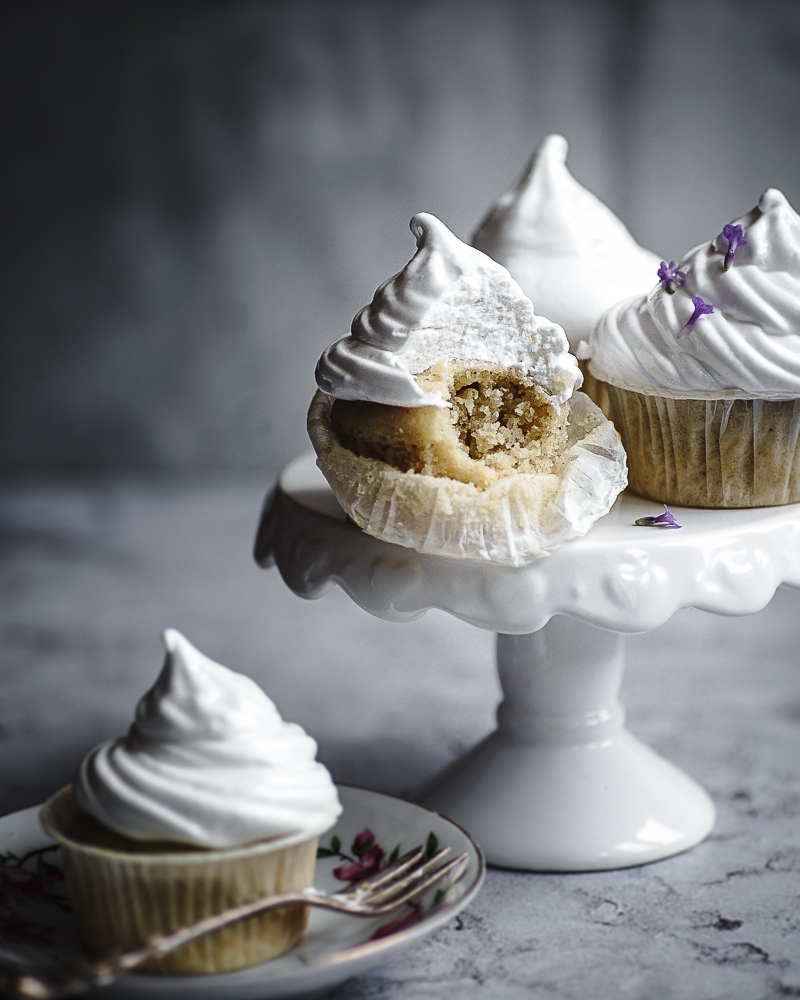 Marshmallow cupcakes on a cake stand.