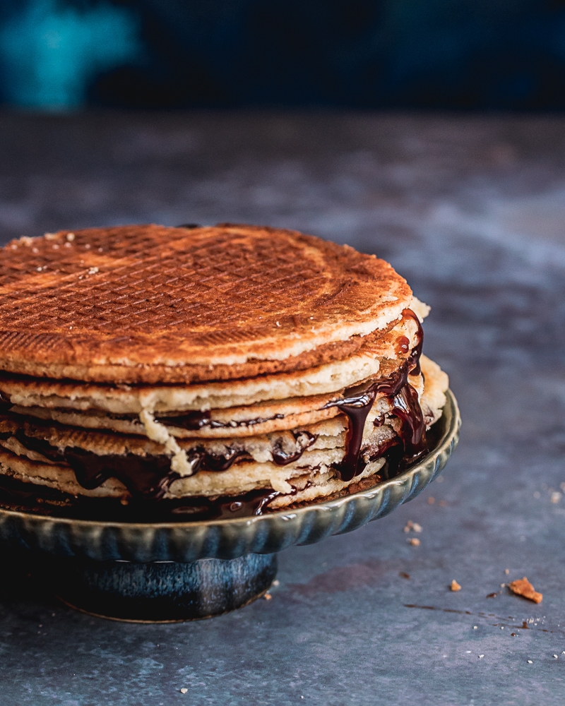 Slicing stropwafels. Make sure not to burn your hands!