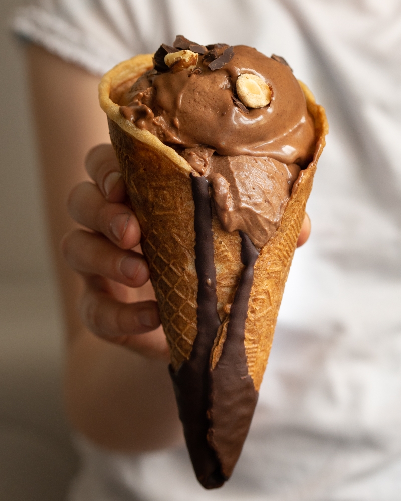 A serving of gianduia ice cream in a cone