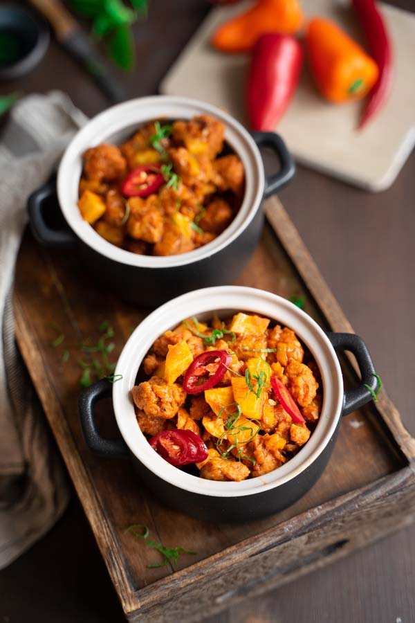 Potato and soy chunks goulash in a small pot.